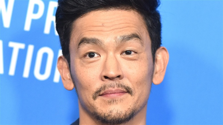 John Cho looking mischievous