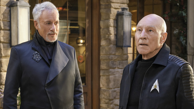 Picard looking exasperated beside Q