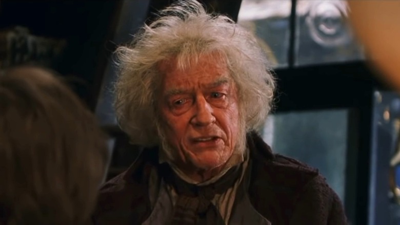 Garrick Ollivander looking at Harry Potter