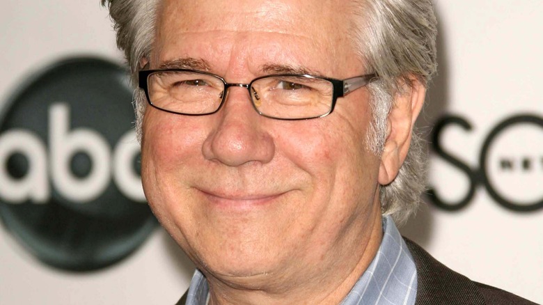 John Larroquette smiling and wearing glasses