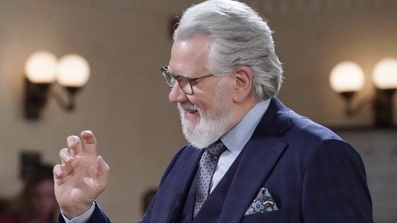 Dan Fielding in court smiling with right hand raised