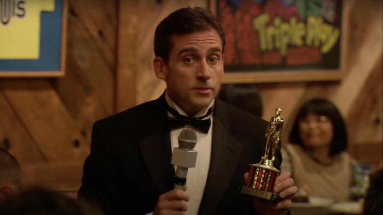 Steve Carell as Michael Scott presenting Dundie 