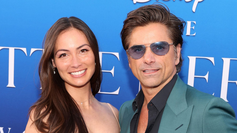 Stamos posing with his wife