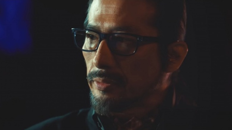 Hiroyuki Sanada wearing glasses and suit
