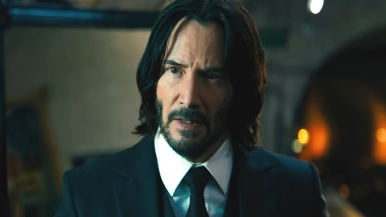 John Wick in candlelit church