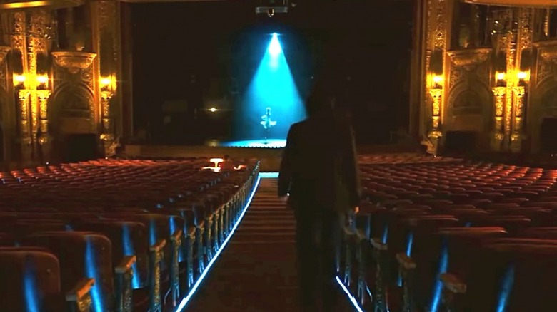 John walking toward Rooney onstage