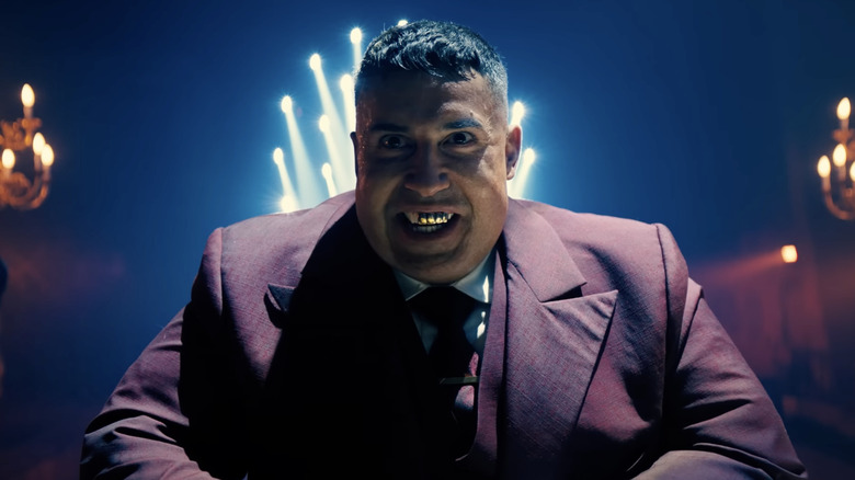 Killa smiling with a gold grille