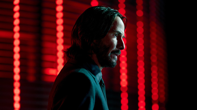 John Wick standing red lights