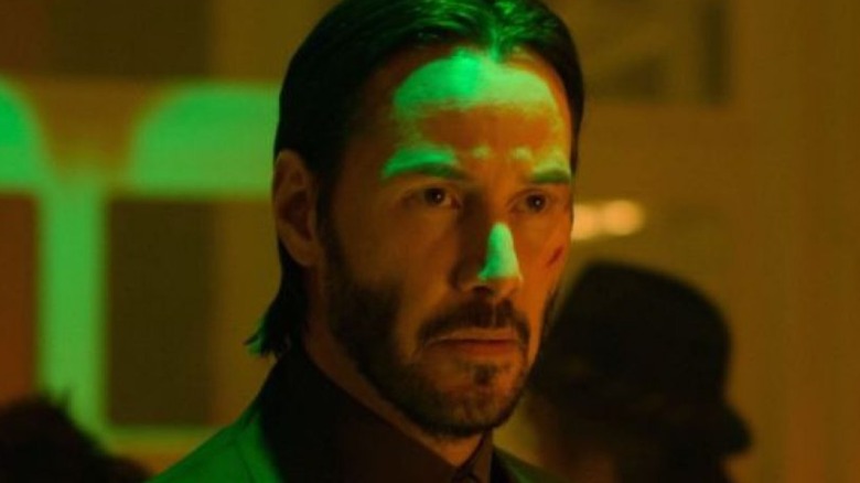 John Wick under green lights