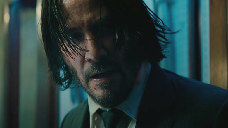 John Wick with scratched face