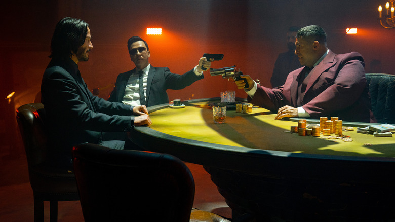 John, Caine, and Killa sitting at poker table