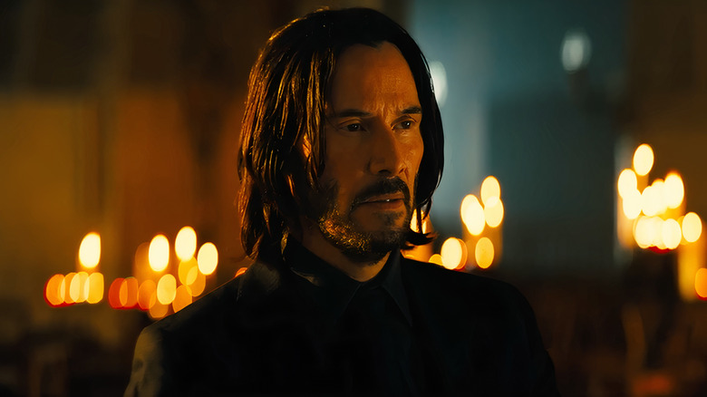 John Wick wearing black suit