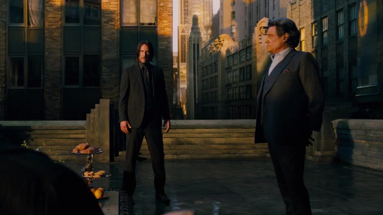 Winston and John Wick on rooftop