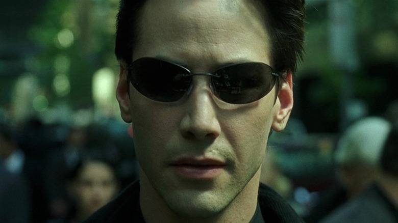 Neo wearing sunglasses in The Matrix