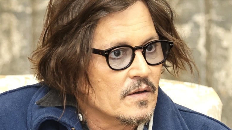 Johnny Depp looking intently at someone