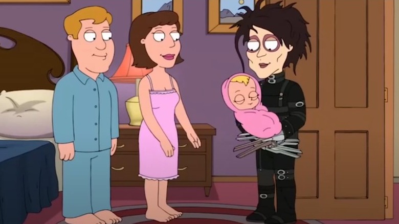 Edward Scissorhands holding baby