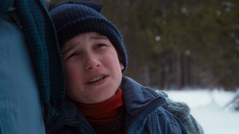 Russ Griswold hugging his father while they stare at their perfect Christmas tree
