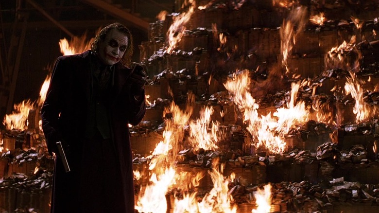 Joker burning his money