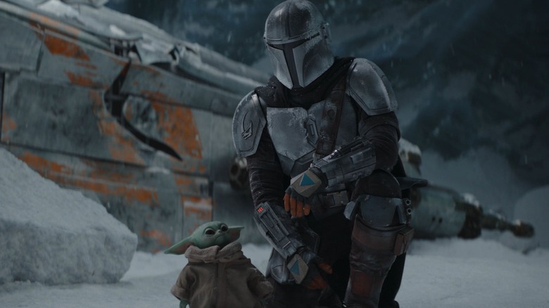 Grogu looking up at The Mandalorian