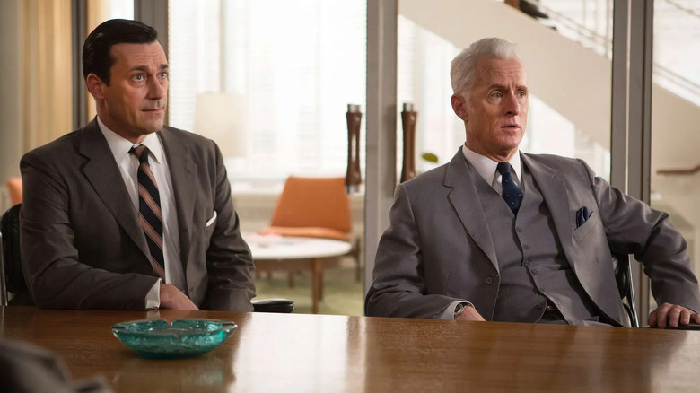 Don and Roger listening to a pitch in the office on Mad Men