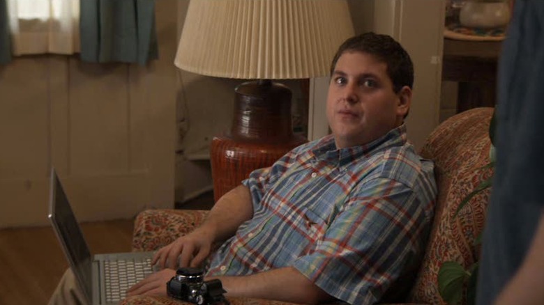 Cyrus using a laptop