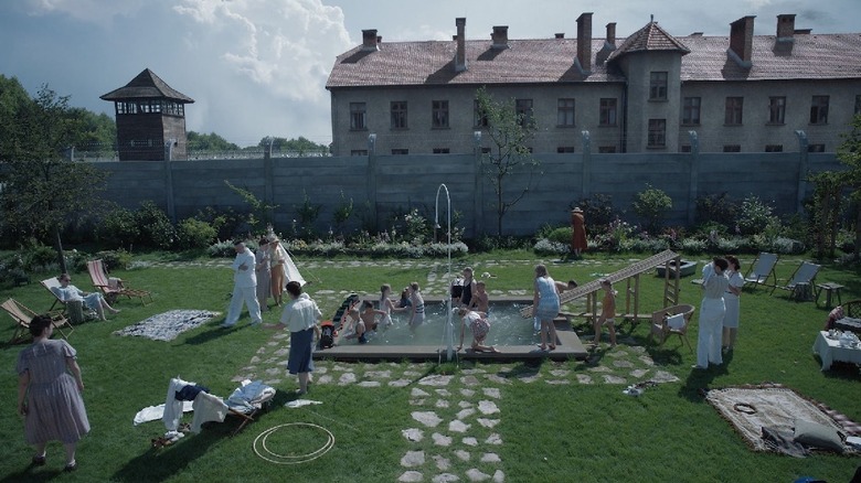 A family picnics outside a concentration camp in "The Zone of Interest" (2023)