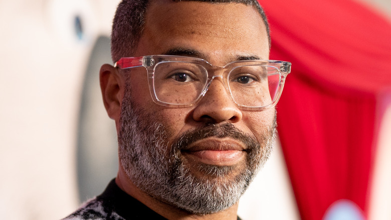 Jordan Peele smirking