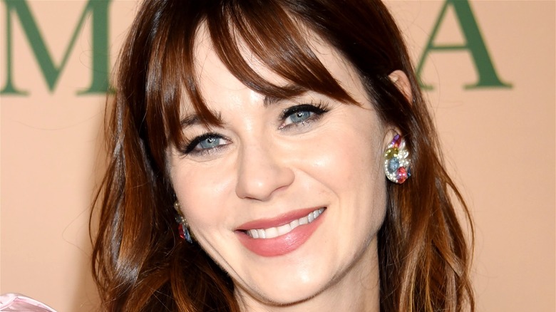 Zooey Deschanel wears multicolor earrings