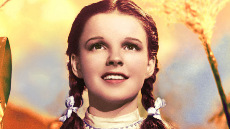 Dorothy Gale standing in a cornfield