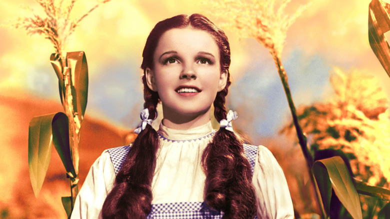 Dorothy Gale standing in a cornfield