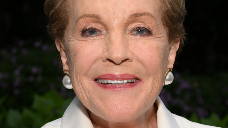 Julie Andrews smiling white jacket