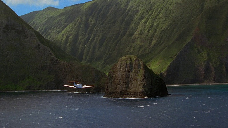 A plane flies near Isla Sorna in "Jurassic Park III" (2001)