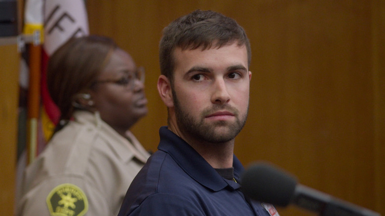 Ronald Gladden on the stand in front of fake bailiff Nikki