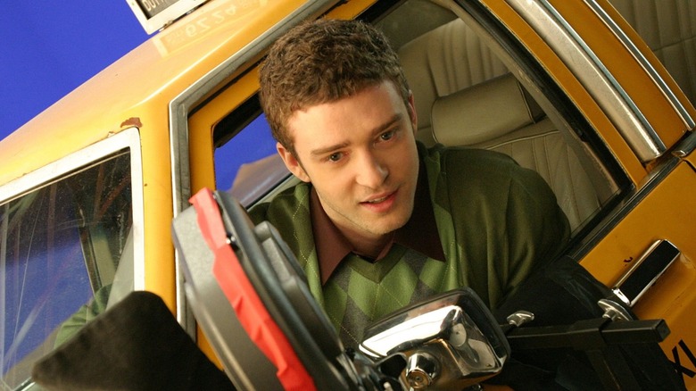 Justin Timberlake leaning out of a cab
