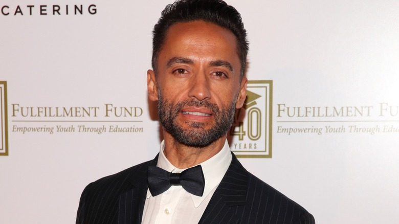 Kamar de los Reyes wears a tuxedo at a benefit