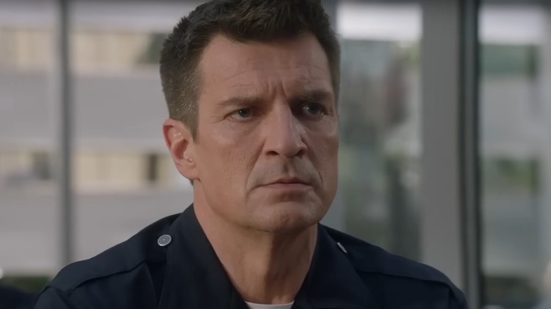 John Nolan wears a police uniform in "The Rookie" (2021)
