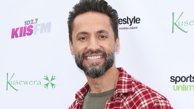 Kamar de los Reyes smiling at a radio station event