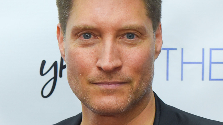 Sean Kanan posing for press