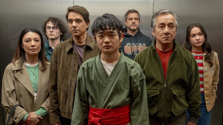 Li Fong's mother, Alan, Daniel, Li Fong, Victor, Mr. Han, and Mia standing in elevator