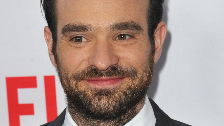 Charlie Cox smiling for press