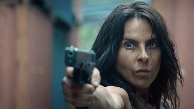 Teresa Mendoza holding a pistol