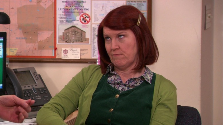 Meredith Palmer sitting at desk listening