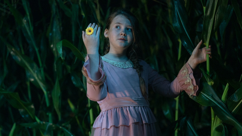 Eden in corn field with flower ring