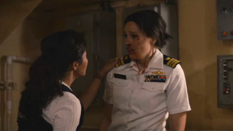 Lucy touching Kate's shoulder