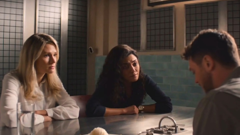 Kate and Lucy looking at suspect