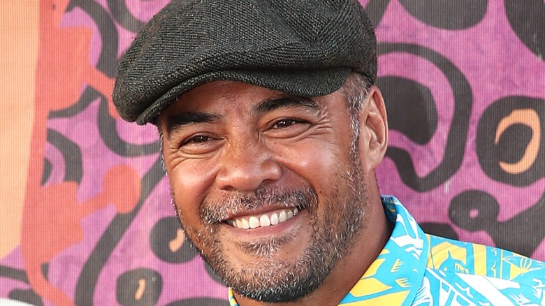 Robbie Magasiva wearing hat smiling