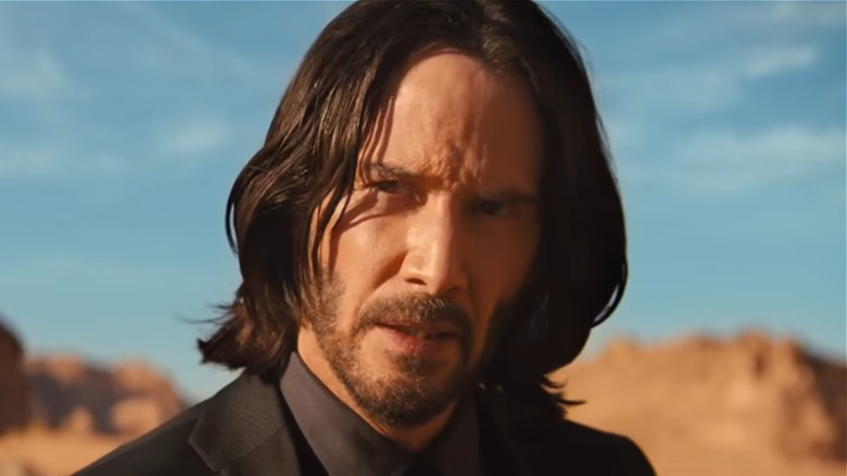 John Wick standing in desert