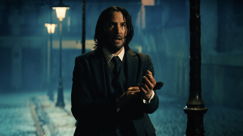 John Wick holding a pistol