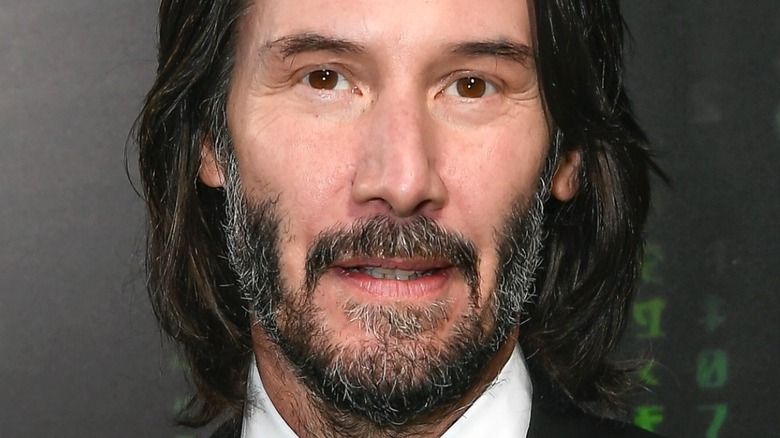 Keanu Reeves smirking 