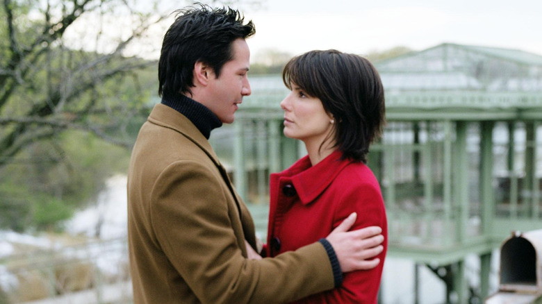 Alex holding Kate by a pier in The Lake House (2006)